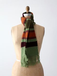 "A vintage stripe knit scarf. The green acrylic scarf features olive, burgundy, and orange stripes. Fringe tassels detail the ends. CONDITION In good condition with wear consistent with age and use. MEASUREMENTS Length: 59\" ... 149.9 cm Width: 5.5\" ... 14 cm 111515 SHOP MORE SCARVES from 86 Vintage https://www.etsy.com/shop/86Vintage86/search?search_query=scarf" Stripe Scarf Pattern, Funky Scarves, Irish Wool Sweaters, Burgundy And Orange, Random Clothes, Stripe Scarf, Orange Scarf, Warm Clothes, Matching Clothes