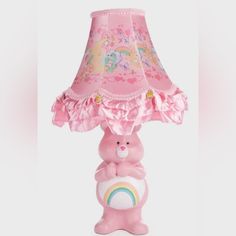 a pink lamp with a teddy bear on it