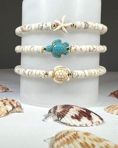 Listing is for ONE bracelet. Pic shown to reflect options. These are the perfect summer bracelet! Choice of White Howlite Turtle, Turquoise Howlite Turtle or Howlite Starfish. -White Turquoise Heishi Rondelle 6mm beads. -Turquoise Turtle, White Turtle and Starfish are all Howlite. -Accent Ball Beads- 14k Gold filled -Knot cover beads - 14k Gold plated -Quality stretch cord. Roll on wrist gently. -IMPORTANT Please see pictures for wrist measurement and sizing instructions. Add approximately .5 inch (half inch) to wrist size for snug comfortable fit. Not all bracelets measure the same. Please see measurements for each bracelet you order in the listings.  It is very important to accurately measure your wrist for proper fit as bracelets are non-returnable. -Be Safe. Small beads are a choking h Summer Bracelets Beads, Heishi Bracelet, Sea Turtle Bracelet, Homemade Bracelets, Jewelry Making Classes, Turtle Jewelry, Summer Bracelet, Turtle Bracelet, Clay Bracelet