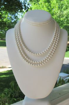 "Chunky Pearl Necklace ~ This elegant staggered three strand pearl necklace makes the perfect bridal jewelry, gifts for bridesmaids, or mother of the bride jewelry! It is lovely accent for your everyday wardrobe as well; so Jackie O! Made with a smaller 6mm Swarovski pearl, it adds such class to any day; whether you are a bride walking down the aisle in her bridal jewelry, or a woman getting ready for a day at the office. This staggered length necklace measures 16\" along the shortest strand wit Elegant Multi-strand Wedding Jewelry, Elegant Multi-strand Wedding Necklace, Elegant Multi-strand Bridal Necklace For Wedding, Classic Multi-strand Pearl Necklace For Wedding, Classic Multi-strand Jewelry For Weddings, Classic Multi-strand Wedding Jewelry, Elegant Multi-strand Bridal Necklace, Classic Double Strand Wedding Necklaces, Multi-strand Pearl Necklace For Wedding