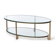 an oval glass coffee table with metal legs and two shelves on one side, against a white background