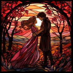 a stained glass window with a man and woman kissing in front of a sunset sky