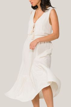 The embodiment of carefree summer spirit. Wear this breathable, versatile dress for a day on the beach, a stroll through the farmers market, or your neighbor's sunset garden party. Spring Breezy Linen Sundress, Summer V-neck Beach Dress For Garden Party, Breezy V-neck Sundress For Daywear, Breezy Beach Dress For Spring, Breezy Sundress For Beach Season Brunch, Beachy Midi Dress For Brunch During Beach Season, Spring Beachwear Maxi Dress For Brunch, Maxi Sundress For Beach Daywear, Maxi Length Sundress For Beach Daywear