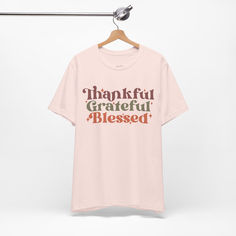 thankful grateful blessed thanksgiving tshirt with retro style font Inspirational Clothing, Thankful Grateful Blessed, Uplifting Words, Grateful Thankful Blessed, Thanksgiving Shirt, Pink T Shirt, Thanksgiving Shirts, Positive Messages, Pink Tshirt