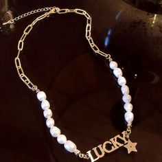 Elevate Your Style with Our Half-O Chain and Half-Pearls Personalized Nameplate Necklace - a True Masterpiece of Elegance and Individuality! A jewelry piece that's the perfect blend of sophistication and personal touch. Crafted with precision, this Nameplate Necklace features half-O chain for a contemporary edge, while the other half boasts lustrous pearls for timeless charm.🌟💎 💖 Personalized Just for You: Customize this necklace with your name or a meaningful word, making it a unique reflect Alloy Pearl Necklace As A Gift, Alloy Pearl Necklace With Clavicle Chain As Gift, Pearl Necklace With Clavicle Chain As Gift, Gold Alloy Jewelry With Pearl Charm, Alloy Pearl Chain Necklace For Gift, Pearl Chain Necklace In Alloy As Gift, Trendy Pearl Necklace With Chain, White Pearl Chain Charm Necklace In Metal, Alloy Chain Pearl Necklace As Gift