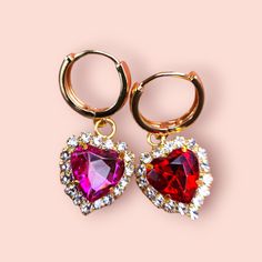 Add a touch of romance and elegance to your jewelry collection with these stunning Heart Crystal Hoop Earrings. Featuring vibrant red and pink heart-shaped crystals, surrounded by sparkling accents, these earrings are perfect for any special occasion or as a thoughtful gift for someone special. Features: ✨ High-Quality Material: Crafted from high-quality alloy and adorned with dazzling crystals, these earrings are plated with 14K real gold for a luxurious and durable finish. ✨ Charming Design: T Pierced Earrings As A Valentine's Day Gift For Her, Valentine's Day Single Dangle Earring Jewelry, Pink Crystal Earrings For Valentine's Day, Red Teardrop Earrings For Valentine's Day, Red Drop Earrings For Valentine's Day, Valentine's Day Crystal Earrings For Pierced Ears, Single Dangle Earring For Valentine's Day, Hoop Earrings For Valentine's Day Party, Single Earring For Valentine's Day Party