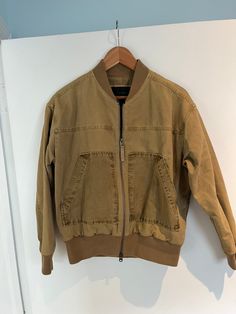 This vintage J.Crew bomber jacket in tan khaki offers a classic workwear-inspired style with a modern twist. Crafted from durable cotton, it features a zip front, ribbed cuffs, and a structured collar for a timeless, functional look. The jacket is lightweight yet sturdy, perfect for layering during cooler months. In size small, this versatile piece combines comfort with utility, making it an essential for any wardrobe. Vintage J Crew, Classic Workwear, J Crew Vintage, Army Jacket, Workwear Jacket, Work Wear, J Crew, Bomber Jacket, Art Collection