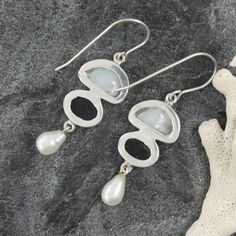 These Sterling Silver Earrings feature White Keshi and Fresh Water Pearl, Paua Shell 7x9 Oval- all set into 3.5 grams of sterling silver