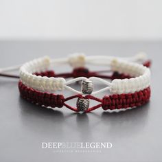 two white and red bracelets with silver beads