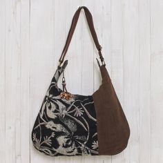 From Thai designer Sansanee Krasae this eye-catching cotton handbag features a floral print inset. In tones of silver deep black and rich brown it opens to reveal a zipper pocket and two open compartments. The zipper pull is adorned with a leather flower. Cheap Bohemian Brown Shoulder Bag, Cheap Bohemian Brown Bags, Cheap Vintage Bags For Fall, Affordable Vintage Bags For Fall, Hobo Purses And Handbags, Affordable Vintage Women's Bags, Fair Trade Gifts, Hobo International Handbags Vintage, Black Rectangular Canvas Hobo Bag