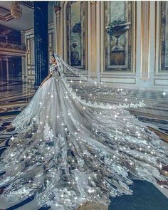 a woman in a white wedding dress with lights on it