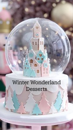 there is a snow globe on top of a cake that says winter wonderland desserts