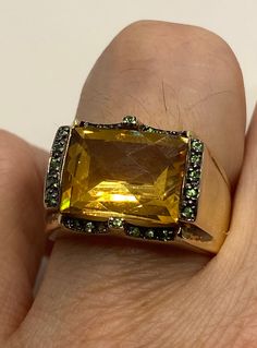 Vintage golden citrine and green chrome diopside 925 sterling silver cocktail ring Unusual cut of citrine in 925 sterling silver setting Handmade Size 7 Can be resized, my jeweler charges $10-$20 All rings are shipped in a nice gift box. Check out our over a THOUSAND great reviews Engraving is $4 per letter and is not always perfect depending on the piece. It can take a few days if the jeweler is busy. This is payable to Paypal Judithsltd@gmail.com Formal Green Citrine Jewelry, Yellow Jewelry With Gemstone Accents For Formal Occasions, Formal Yellow Jewelry With Gemstone Accents, Green Citrine Gemstone Rings, Green Citrine Jewelry Gift, Elegant Green Citrine Jewelry, Green Citrine Jewelry For Gifts, Green Multi-stone Topaz Ring For Formal Occasions, Oval Citrine Green Jewelry