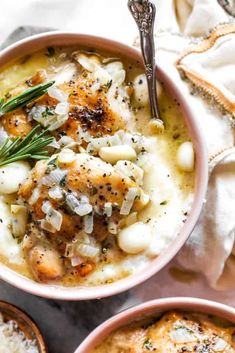 three bowls filled with food on top of a table