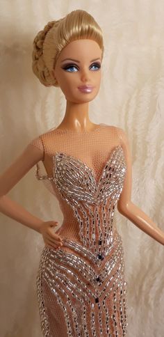 a barbie doll wearing a dress made out of sequins