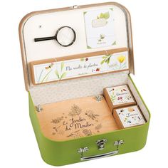 Age: 6+ Discover the natural world of Le Jardin du Moulin! Preserve delicate flowers, chart new paths and explore the outdoors with the entire collection!This Botanist Case includes one Flower Press, a Magnifying Glass, one Notebook and three whimsical boxes to preserve tiny treasures! Packaged in a tan and green case, perfect for toting a botanical collection. Size: 12"x8.5"x3.5" Cardboard Suitcase, The Botanist, Steam Toys, Cute Suitcases, Flower Press, Outdoor Gifts, Green Cases, Botanical Collection, Play Tent