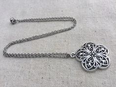 "Chic and pretty boho flower pendant necklace. It has incredible detail and is very versatile. The perfect everyday necklace! It would also make a sweet little gift. The pendant measures 1 1/8\" long by 1\" wide and hangs from a simple stainless steel necklace chain with a lobster clasp. I have matching earrings in my shop, if you would like the whole set. Here is the link https://etsy.me/35eCXaU Thanks for stopping by! Please take a moment and visit the rest of my Etsy shop. I have many more un Bohemian Charm Necklace With Flower Pendant For Gift, Bohemian Flower Pendant Charm Necklace As Gift, Bohemian Metal Jewelry With Flower Charm, Bohemian Necklace With Flower Pendant As Gift, Bohemian Flower-shaped Nickel-free Necklace, Bohemian Necklace With Flower Pendant, Bohemian Flower Pendant Necklace As Gift, Bohemian Flower-shaped Nickel Free Necklace, Silver Necklace With Delicate Chain For Festivals