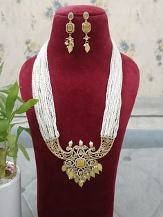 A Gift for someone most adorable for you. Suitable for all kind of outfits like lehenga, dresses, sarees . Necklace : 1 Earring:  1 Handmade Pearl Kundan Necklace For Festivals, Festive Handmade Pearl Kundan Necklace, Elegant Long Kundan Necklace With Latkans, Elegant Kundan Necklace With Pearl Chain For Puja, Handmade Pearl Kundan Necklace In Temple Jewelry Style, Handmade Pearl Kundan Necklace In Temple Style, Elegant Kundan Pearl Necklace For Puja, Elegant Chandbali Pearl Necklace For Puja, Elegant Long Kundan Necklace For Puja