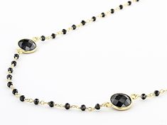 26.00ctw round black spinel 18k yellow gold over sterling silver necklace. Measures approximately .35"W. Lobster Clasp closure. Black Spinel Gemstone Necklace For Gift, Elegant Black Spinel Beaded Necklaces, Black Spinel Round Beads Jewelry For Gifts, Elegant Silver Black Spinel Necklace, Faceted Black Spinel Necklace, Black Spinel, Sterling Silver Necklaces, Silver Necklace, Beaded Necklace