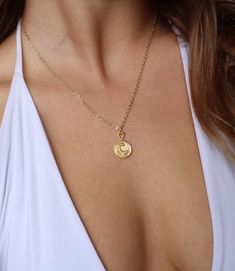 This 14kt golden plated necklace features a shining coin, with a flowing wave pattern.  Chain is adjustable and measures 17-19inches. Ocean Pendant, Wave Jewelry, Jewelry Ocean, Wave Necklace, Ocean Jewelry, Plate Necklace, Wave Pattern, Everyday Jewelry, Jewelry Necklace Pendant