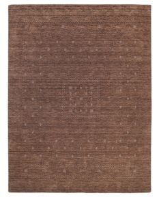 a brown rug with dots and squares on it