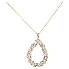 This pear shaped necklace is a gorgeous statement on any neck! The double pear is an open design that has 24 glorious diamonds that are bezel set and alternate with a lovely gold bead. The pendant is flat but 1 5/8 inches long. A drop diamond or gemstone could be added to the center of the pendant if you had a gemstone that you wanted to mount in a pendant. Such a graceful jewelry item! Material: 14K Gold Diamond Count: 24 Diamond Weight: .16 carats Diamond Clarity: VS-2 Diamond Color: G-H Measu Elegant Pear-shaped Drop Necklace With Diamond Accents, Pear-shaped Necklace With 17 Jewels, Pear-shaped Diamond Necklace, Elegant Gold Diamond Necklace With Pear-shaped Pendant, Elegant Gold Pear-shaped Diamond Necklace, Pear-shaped Yellow Gold Diamond Necklace, Elegant Gold Teardrop Diamond Necklace, Pear-shaped Drop Necklace With Diamond Accents, Teardrop Diamond Accented Necklace