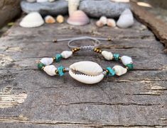 Mother nature creates best jewelry pieces! An authentic selection of natural shells handpicked from Greek beaches around the islands of the  Aegean sea! Hand-crafted into one of a kind, summer bohemian bracelet!  ▽▲Details▽▲ ★15-16m aprox. natural Cowrie shell ★9mm aprox natural white cone snail shells  ★5-7mm natural turquoise chips ★4mm round African Turquoise beads  ★mineral graphite beads ★clever fastening to secure perfect fit  ★Fine quality silk thread ★Adjustable Length ★Nickel free/Allerge free materials  ★Waterproof  ★Made in Greece! These unique shells are handpickjed from the beaches of the islands around the South Aegean sea. They are 100% natural & one of a kind pieces.  Perfect gift idea for birthdays, celebrations & anniversaries!  'Πάθος' is the Greek word for 'Passion' Lux White Bohemian Shell Bracelet, Cowrie Shell Beaded Bracelets As Gift, Shell Bracelet Jewelry For Vacation, Shell Jewelry Bracelet For Vacation, Beachy Shell Bracelet Jewelry, Bohemian Beaded Shell Friendship Bracelets, Handmade Spiritual Shell, White Bohemian Beaded Shell Bracelets, Shell Bracelet For Beach