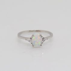 Vintage Sterling Silver White Opal & Triangle White Topaz Ring...Marked 925...Total of weights 1.9grams... Size 9...Measure of stone center 6.5 x 4.5MM...It's in very good condition.  B Opal Ring Simple, Topas Ring, White Opal, Topaz Ring, White Topaz, Opal Gemstone, Opal Rings, Ring Verlobung, Vintage Sterling Silver