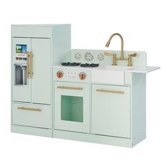 a toy kitchen with an oven, sink and refrigerator in mint green painted wooden cabinets