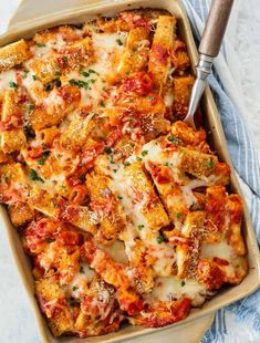 a casserole dish filled with chicken parmesan