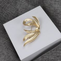 This gold vintage brooch is the perfect way to show your appreciation and love for your mother, wife, or daughter. It also makes a fantastic gift for Mother's Day or a birthday present for that someone special.👌 M A T E R I A L• 18K Gold plated over brass• This product is hypoallergenic (nickel free) and tarnish resistant📏 S I Z E• Length: 7 cm (2.8 inch)• Width: 4.5 cm (1.8 inch)• Weight: 11.13 g Gold Brooch Jewelry For Wedding, Gold Wedding Brooch Jewelry, Gold Wedding Jewelry With Brooch, Wedding Yellow Gold Lapel Pin, Gold Lapel Pin For Party, Vintage Gold Jewelry For Birthday Gift, Yellow Gold Brooches For Anniversary, Vintage Yellow Gold Pins For Gifts, Vintage Gold Pins For Anniversary