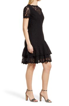 A lacy overlay adds stylish definition to an elegant and sophisticated cocktail dress styled with a ruffled skirt and pretty scalloped details. 38" length Hidden back-zip closure Bateau neck Short sleeves Lined 70% cotton, 30% nylon Dry clean Imported Women's Clothing Evening Lace Dress With Scalloped Edges, Elegant Lace Dress With Scalloped Edges For Evening, Elegant Evening Lace Dress With Scalloped Edges, Elegant Fit And Flare Lace Dress With Lace Trim, Elegant Lace Trim Fit And Flare Dress, Party Dresses With Scalloped Edges, Mini Length, Lace Evening Dress With Scalloped Edges, Party Dress With Scalloped Edges In Mini Length, Party Dress With Scalloped Edges Mini Length