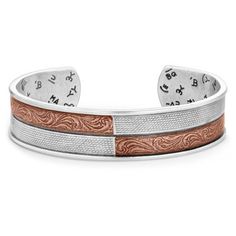 Stand out with the Inner Light Cuff Bracelet. This bracelet gives the illusion of two smaller bracelets side by side. Stunning engraved patterns cover this bracelet. A copper tone in the top right and bottom left contrasts the antiqued silver finish. The engravings are enclosed by a smooth border. The bracelet is a cuff and one size fits most. All Montana Silversmiths jewelry and accessories are coated with Montana Armor to prevent tarnish. This cuff bracelet can be adjusted allowing one size to fit most. Shine your inner light with this statement piece. Marvel at the antiqued silver and copper design. Montana Silversmith Jewelry, Copper Design, Small Bracelets, Tractor Supplies, Inner Light, Tractor Supply, Jewelry And Accessories, Side By Side, Women Accessories Jewelry