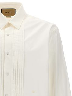 Cotton shirt with pleated plastron, button closure, long cuffed sleeves. Composition: 100% cotton Gucci Cotton Shirt For Workwear, Gucci Cotton Shirt For Work, Gucci Button-up Shirt For Spring, Gucci Spring Button-up Shirt, Designer Long Sleeve Dress Shirt For Work, Spring Gucci Button-up Shirt, Classic Cotton Tops With Pleated Sleeves, Luxury Long Sleeve Cotton Shirt, Elegant Gucci Office Blouse