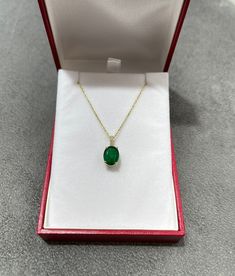 Featured here is a stunning oval emerald & diamond accent necklace in fine 18k yellow gold. Displayed in the center is a deep green emerald accented by a simple four-prong gold mount, allowing for the emerald to be shown in full view. Diamonds accent the bale of the pendant. The earth mined, green emerald has a desirable lush green color with excellent qualities. The chain is sold separately. Total Carat Weight: 2.82cts Setting Style: Four Prong Setting Material: 18k Yellow Gold Main Stone: Luxury Oval Necklace With Prong Setting, Oval Link Yellow Gold Diamond Necklace Gift, Exquisite Oval Diamond Necklaces, Exquisite Oval Diamond Necklace Gift, Exquisite Gold Oval Diamond Necklace, Yellow Gold Diamond Necklace With Oval Links For Gift, Exquisite Oval Diamond Necklace For Gift, Green Oval Necklace For Formal Occasions, Formal Green Oval Necklace