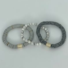 This gorgeous stack bracelet set is made up of three pieces. One Silver Halo bracelet One 8mm Heishi Grey Dot bracelet One light grey 8mm Heishi bracelet Trendy Adjustable Gray Bracelet, Casual Gray Bracelets For Everyday, Gray Adjustable Stretch Bracelet As Gift, Adjustable Gray Stretch Bracelet Gift, Gray Adjustable Stretch Bracelet For Gift, Adjustable Gray Stretch Bracelet For Gift, Elegant Gray Bracelets For Everyday, Gray Round Beads Jewelry For Everyday, Adjustable Gray Stretch Bracelet With Round Beads