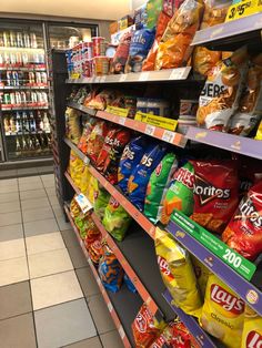 a grocery store filled with lots of different types of food and snacks on display next to each other