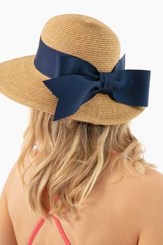 Toucan Hats makes our best-selling and beloved beach accessories.This bow-trimmed hat offers pretty protection from the sun with a nautical navy ribbon detail. Wear to the beach with your favorite caftan for a classic, feminine, and practical finishing touch. The best part? It's packable so it will easily fit in your suitcase or weekender, and keeps its shape after you pull it out. Wide brim Navy bow detail Packable Material: Woven Straw Vacation Sun Hat With Ribbon And Short Brim, Summer Straw Hat With Ribbon For Vacation, Spring Vacation Sun Hat With Ribbon, Vacation Straw Hat With Ribbon And Short Brim, Vacation Wide Brim Sun Hat With Ribbon, Summer Straw Hat With Ribbon For Beach, Adjustable Bow Boater Hat For Kentucky Derby, Summer Beach Sun Hat With Ribbon, Adjustable Boater Hat With Bow For Kentucky Derby