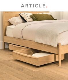 a bed with two drawers underneath it and the words article above it that says,