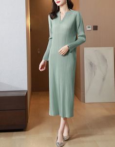 This versatile Pleated Long Sleeve Slim Fit Midi Dress can be dressed up or down to suit any situation. The lightweight fabric also lets you stay cool on a hot summer day. Winter Stretch V-neck Dress, Chic Green V-neck Sweater Dress, Winter V-neck Stretch Long Sleeve Dress, Elegant Green V-neck Mini Dress, Stretch V-neck Winter Dress, Elegant Green V-neck Long Sleeve Dress, Winter V-neck Stretch Dress, Casual V-neck Sweater Dress For Spring, Chic Long Sleeve V-neck Dress For Winter