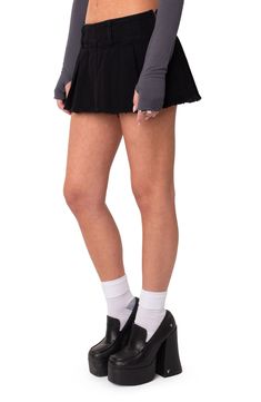 This barely there nonstretch-denim skort is flared and punctuated with a raw, fringed hem to convey rock 'n' roll swagger. 100% cotton Machine wash, dry flat Imported Stretch Punk Mini-length Bottoms, Punk Style Stretch Mini Bottoms, Fitted Mini Length Grunge Bottoms, Edgy Fitted Cutoff Mini Skirt, Grunge Fitted Mini Bottoms, Edgy Fitted Cutoff Denim Skirt, Grunge Mini Length Bottoms, Distressed Short Bottoms For Fall, Distressed Short Length Bottoms For Fall