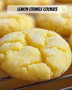 lemon crinkle cookies on a cooling rack with the words lemon crinkle cookies