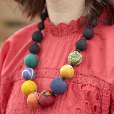 A constellation of colorful repurposed Kantha beads brightens up a background of black beads, representative of the night sky. Sustainably handmade by women artisans in India. Artisan Multicolor Jewelry With Black Beads, Handmade Black Jewelry For Festivals, Festive Handmade Black Necklace, Handmade Black Necklaces For Festivals, Handmade Black Necklace For Festivals, Artistic Multicolor Necklace For Festivals, Artisan Black Beads For Festivals, Black Artisan Beaded Chain Jewelry, Artisan Black Beaded Chain Jewelry