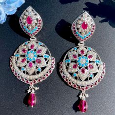 Featuring a pair of statement earrings on pure 925 sterling silver studded with pearls, ruby like red stones and turquoise. The earrings are in silver finish without gold plating done. They close with a bombay screw mechanism Jadau Earrings, 22k Gold Jewelry Necklaces, 22k Gold Jewelry, Red Stones, Pearl Necklace Set, Gold Jewelry Necklace, Emerald Necklace, Gold Bangle Bracelet, Red Stone