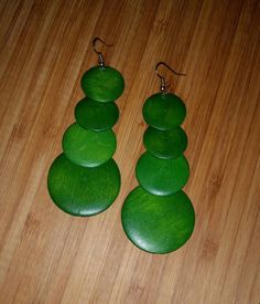 "Green Wooden Earrings. High Quality & Comfort Fit. Lightweight Dangle Earrings. Handmade Ethnic Design Length: 3\"&3/4\" Inches FAST SHIPPING! Visit my Etsy Shop to see more Designs! Handmade Earrings, Bracelets and Necklace https://www.etsy.com/shop/FreedomLifeStyle" Adjustable Green Drop Plug Earrings, Elegant Green Circular Earrings, Green Dangle Earrings For Pierced Ears, Unique Green Dangle Earrings, Green Chandelier Earrings With Pierced Ears, Green Round Chandelier Earrings As Gift, Green Round Chandelier Earrings For Gift, Bohemian Green Circular Earrings, Green Bohemian Circle Earrings