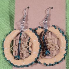 These Native American Dreamcatcher Earrings Are Vintage. Handmade With Leather, Glass Beads, And I Believe Catgut (Intestines). Glass Beads Are Turquoise Green And Black. I Have Put Them On New Cardstock, Rubber Earring Backs, And Archival Sleeve. I'm Not Sure They Were Ever Worn As They Are In Such Nice Condition. These Are An Estate Item From Here In The Southwest. Please Reach Out If You Have Any Questions. We Are A Smoke-Free And Pet Friendly Home. Items Are Cleaned As Able And Stored In Plastic Away From Pets Until They Are Shipped. Thank You Bohemian Brown Beaded Round Earrings, Brown Beaded Southwestern Jewelry, Southwestern Brown Beaded Jewelry, Brown Southwestern Teardrop Jewelry, Southwestern Style Brown Beaded Jewelry, Southwestern Brown Teardrop Jewelry, Southwestern Style Brown Teardrop Jewelry, Southwestern Style Teardrop Brown Jewelry, Artisan Brown Beaded Earrings For Pierced Ears