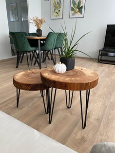 two wooden tables with hairpin legs in a living room next to a table and chairs