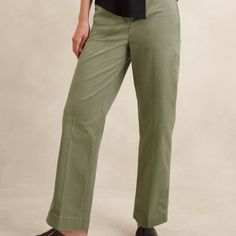 Made With Organically Grown Cotton And A Touch Of Spandex For Comfort And All Day Ease. Chino Pants Are Full Length And Feature Adjustable Button Tabs At Cuffs. Fabric Buckle Belt Included. Machine Washable. Spring Workwear Chinos Full Length, Spring Workwear Full-length Chinos, Versatile Full-length Cotton Pants, Green Wide Leg Chinos For Work, Wide Leg Green Chinos For Work, Versatile Green Straight Leg Bottoms, Versatile Straight Leg Chinos For Spring, Spring Green Wide Leg Chinos, Spring Relaxed Fit Full Length Chinos