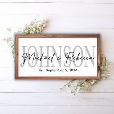 a wooden framed sign with the words wedding and reception printed on it next to some baby's breath flowers