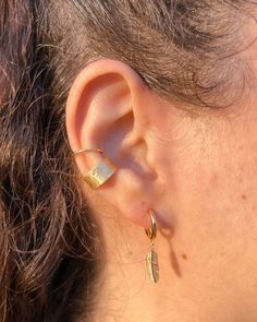 Our "Boho Ear Cuff" is a captivating and eye-catching piece that effortlessly stands out! This bold and shiny ear cuff is perfect for those who want to make a statement without the need for a piercing. Crafted with utmost precision, this extraordinary cuff features a 14k gold filled finish, exuding luxury and elegance. Wear it with confidence on your cartilage for a unique and stylish look. Elevate your jewelry collection with this exquisite ear cuff that adds a touch of glamour to any ensemble. This ear cuff is a perfect gift choise for your loved ones, him or her, or yourself! ✽ %100 Handmade ✽ 925k Silver material with 14k Gold Filled or Rhodium plated (silver color) surface. ✽ Does not require any piercings ✽ The product is non-oxidizing and nickel-free. Thick gold filled or rhodium pl Handmade Adjustable Gold Ear Cuff, Gold Bohemian Wrap Earrings, Adjustable Gold Pierced Ear Cuff, Adjustable Gold Ear Cuff For Festivals, Adjustable Gold Wrap Single Earring, Adjustable Single Gold Wrap Earring, Gold Bohemian Wrap Earrings For Festivals, Bohemian Gold Wrap Earrings For Festival, Adjustable Pierced Ear Climbers As Gift